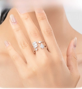 Detail of S925 sterling silver double-layer ring with baguette and teardrop zircons