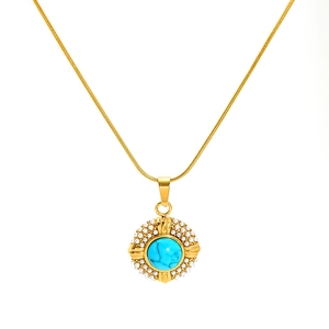 Elegant gold-tone necklace with turquoise center stone and pearl border on white background