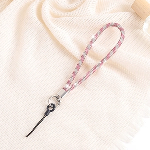 Luxurious pink and silver rhinestone phone chain with metal clasp on knit background