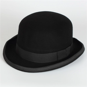 Classic black wool bowler hat with matching ribbon and rolled brim in vintage style
