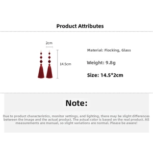 Detail view of red flocked beaded tassel earrings with material and size specifications
