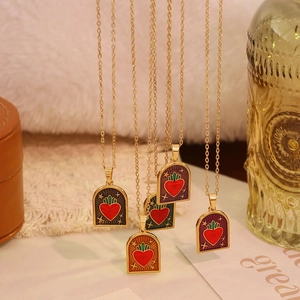 Vintage gold heart enamel pendants with celestial star patterns in four colors