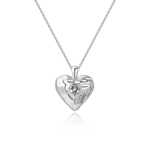 Close-up of heart pendant with irregular hammered texture and sparkling center zircon stone