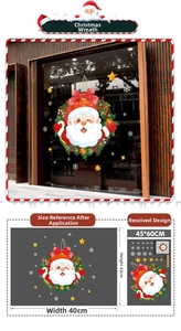 Detail view of double-sided Christmas wreath window stickers with Santa Claus and snowflakes