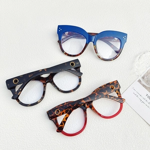 Detailed view of fashion cat-eye glasses frames with golden rivets in three assorted colors