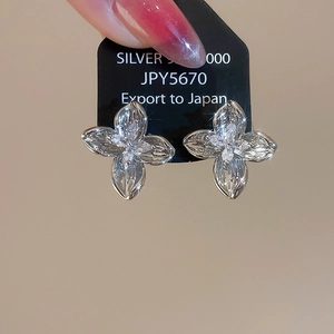 Close-up of S925 silver flower stud earrings with marquise-cut sparkling zircon stones