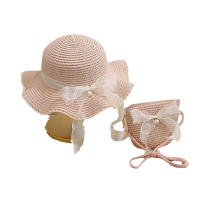 Pink straw sun hat and matching crossbody bag set with elegant organza bow and pearls