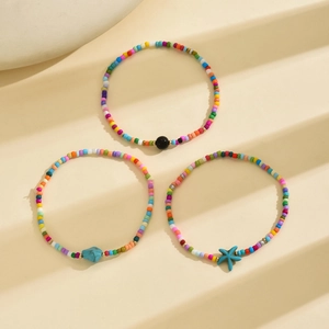 Close-up of Bohemian anklet set with turquoise starfish charms and colorful seed beads