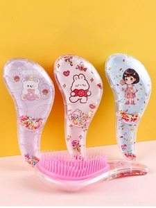 Close-up of detangling brushes with high-low bristles and cute cartoon characters