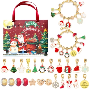 Detailed view of kids' Christmas countdown advent calendar with golden DIY charm bracelets