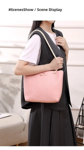 Close-up of pink tote bag with V-shaped quilting and stylish white rope handles