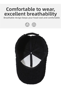 Detail of the breathable mesh lining and internal structure of the black fleece baseball cap