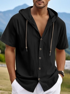 Outdoor shot of black short sleeve hooded shirt showing linen texture and button details