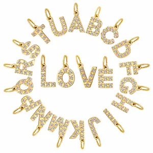 Lot de 26 breloques lettres alphabet en acier doré et zircons pour la création de bijoux DIY.