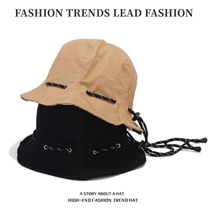 Foldable drawstring bucket hat in khaki and black canvas with adjustable sports cord
