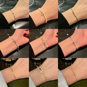 Collection of vintage pearl and titanium steel bracelets with zircon charms and gemstones
