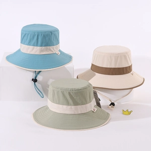 Detailed view of color-block kids bucket hats with adjustable windproof drawstrings