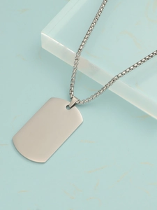 Polished silver stainless steel dog tag pendant with durable box chain on marble surface