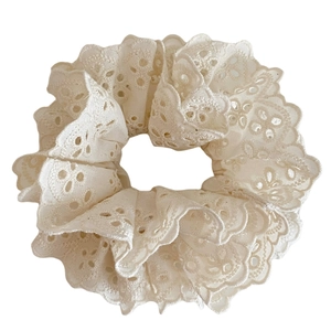 Elegant cream lace scrunchie with hollow floral embroidery and vintage wavy edges
