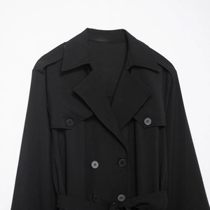 Classic black double-breasted trench dress featuring notched lapels and shoulder epaulettes
