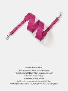 Detail of adjustable magenta leather shoulder strap with silver swivel hook and smooth finish
