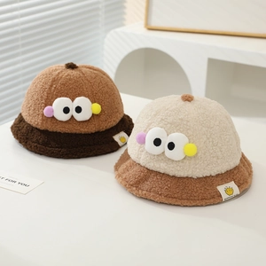 Plush lamb wool bucket hats for kids featuring cute big eyes and warm pom-pom decor