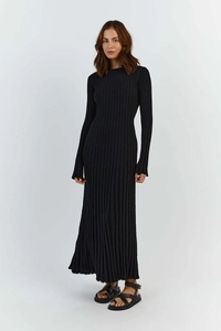 Detail of black long-sleeve knit maxi dress showing fine ribbed texture and elegant drape