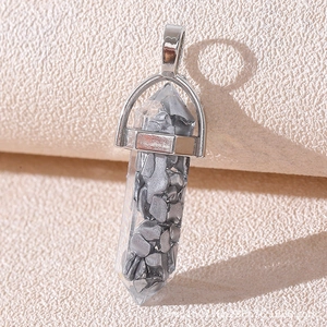 Detailed view of silver hexagonal crystal pendant filled with grey stone chips