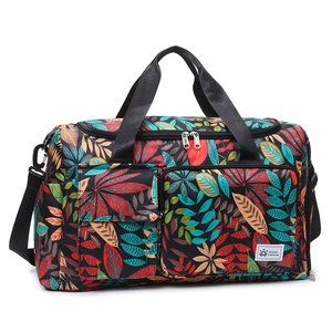 Large travel tote bag with colorful leaf print and adjustable shoulder strap
