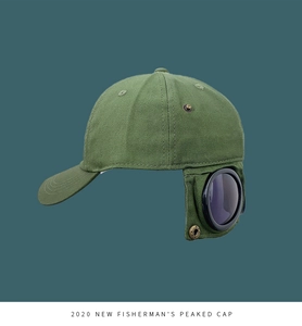 Detail view of army green aviator baseball cap with integrated goggles on canvas fabric