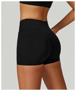 Close-up of black high-waisted yoga shorts featuring functional side phone pockets