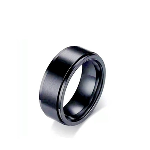 Detailed close-up of a matte black brushed spinner ring with polished edges and a wide band