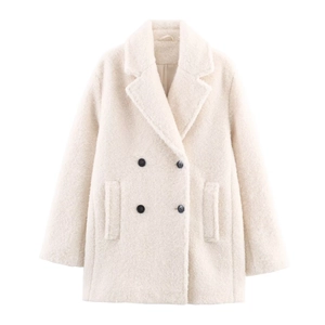 Women's cream double-breasted sherpa coat in mid-length with classic lapel and black buttons