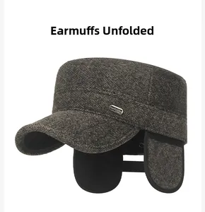 Close-up of winter flat cap showing ear flaps deployment and tweed herringbone texture