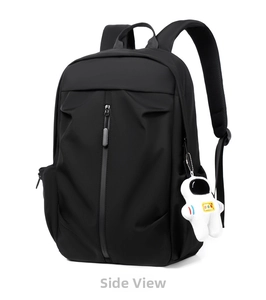 Detail of waterproof Oxford cloth backpack with side pocket and astronaut plush charm