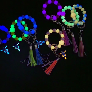 Luminous silicone bead keychain with bull head pendant and colorful tassels in the dark