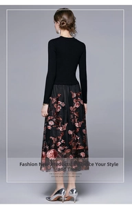 Detail view of exquisite red-brown floral embroidery on black mesh tulle skirt