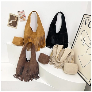 Detail view of suede tassel tote bag set with matching inner pouch in four colors