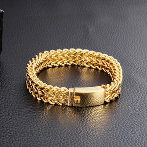 Close-up of golden stainless steel Franco chain bracelet with a secure fold-over clasp