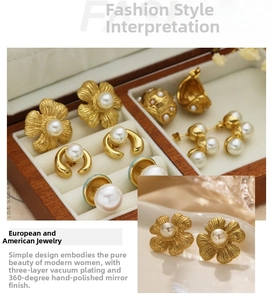 Detail of 18k gold plated flower and pearl earrings with hand-polished finish