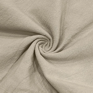 Macro detail of breathable khaki linen blend fabric texture with soft natural wrinkles