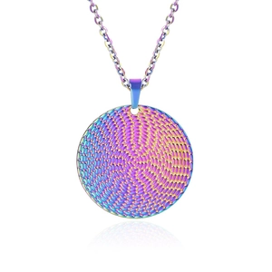 Macro detail of round stainless steel pendant with rainbow woven texture finish