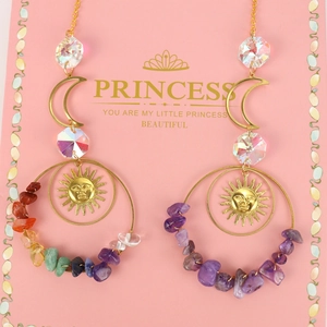 Detail of sun and moon earrings with rainbow crystal beads and purple crushed stones
