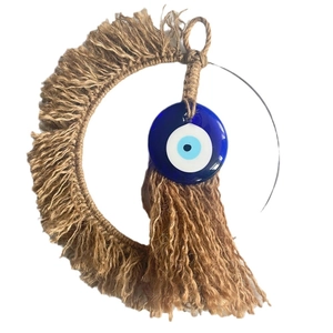 Bohemian crescent jute wall hanging with blue evil eye bead and tassel fringe decor