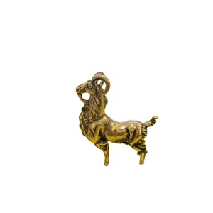 Vintage copper-plated goat miniature figurine with detailed textured fur on white background
