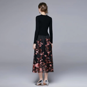 Elegant black long-sleeved dress with floral embroidery and tiered mesh skirt back view