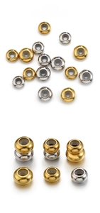 Macro detail of polished gold and silver stainless steel slider beads for DIY jewelry