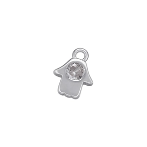 Macro shot of silver Hamsa palm pendant with micro-inset sparkling central zircon gem