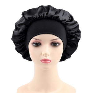 Detail of black satin hair bonnet with elastic band shown on a mannequin head