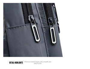 Detail of high-density nylon texture and smooth dual matte black metal zippers on the chest bag